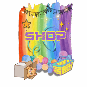 text reads "shop" in purple square bubble writing with a yellow border. The background is a rainbow wash, with bunting and round fairy lights at the top, stars and ribbons swirling behind the text, and circles of various colours at the bottom. In front of the circles is a tabby cat peeking out of a box, and a yellow shopping basket with turquoise handles.